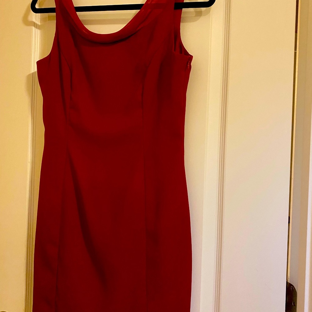Classic short dress with sheer accent at neckline. Length from front neck 28”